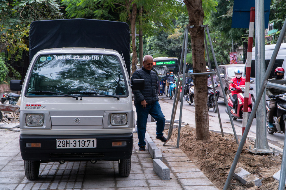 Hanoi sidewalks with projected 70-year lifespan poised for dilapidation by illegally parked cars